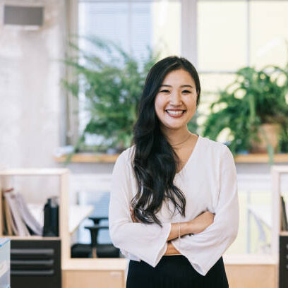 Portrait of confident Japanese female architect at modern office space. Portrait of confident Japanese female architect at modern office space.